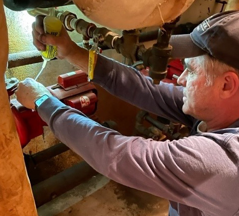 A man working on Boiler Maintenance.